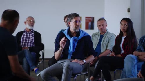 Adults Gather for Meeting in Bright Room