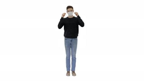 Young Adult Removes Face Mask on White Background