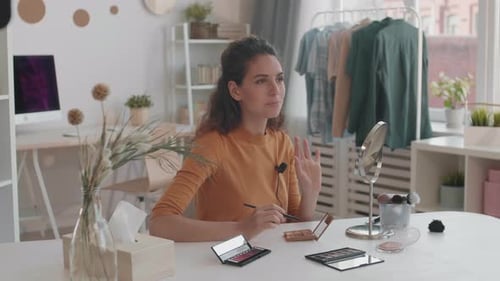 Woman Applies Makeup While Vlogging at Home