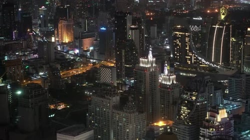 Lights the Night City in The Business District. Skyscrapers and Financial Centers