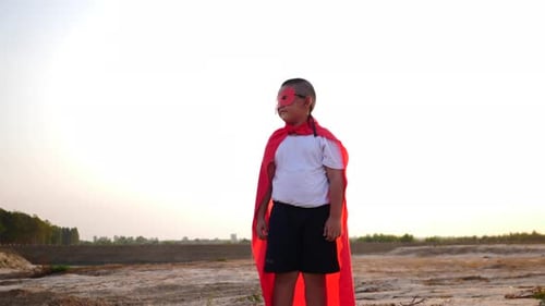 superhero boy running on the field