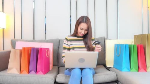 Woman Shopping Online At Home With Laptop