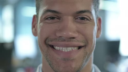 Close Up Of Cheerful African Man Smiling at Camera