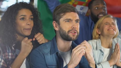 Excited Fans Cheer on Sports Team