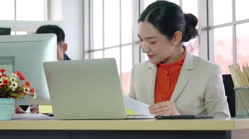 Business People Working at Table in Modern Office