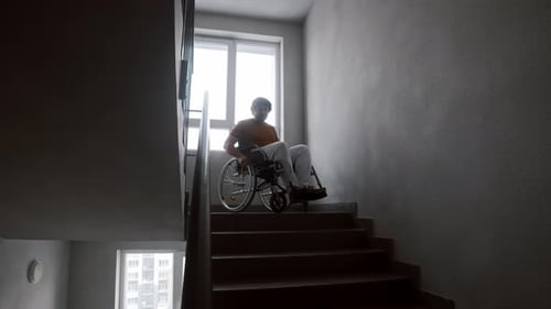Person in Wheelchair on Stairwell