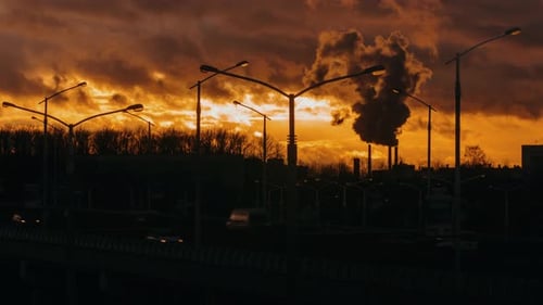 Industrial Zone From City Pipe Thick Smoke is Poured From Factory Sunset, Pollute Atmosphere