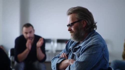 Adults Participate in Group Meeting