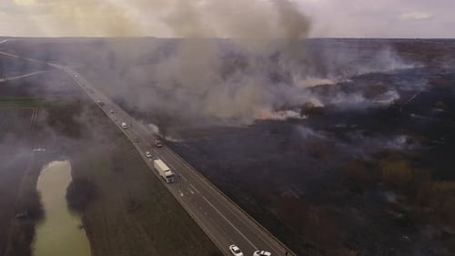 Brush Fire Burns near Highway from Aerial View