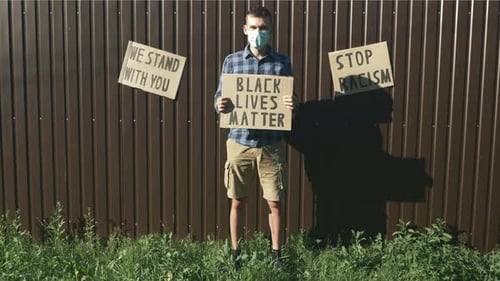 Young Adult Holds Black Lives Matter Sign