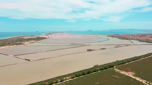 Multicolored Salt Lakes with Coastal Salt Marshes, Aerial View, Video Shooting with Drone. Pink Salt