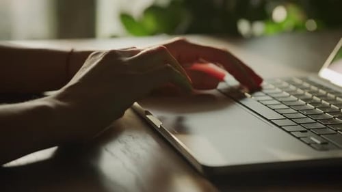 Close Up of Woman Hands Typing and Scrolling on Laptop Computer Touchpad and Keyboard