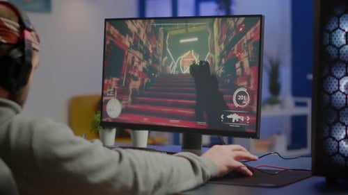 Focused Gamer Plays First Person Shooter at Home