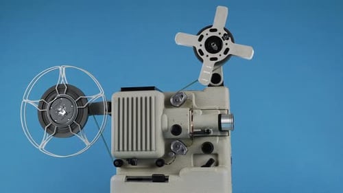 Vintage Film Projector with Reels on Blue Background