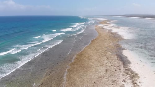 Ocean Coastline and Barrier Reef at Low Tide Zanzibar Matemwe Aerial View