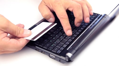 Person Making Online Purchase on Computer