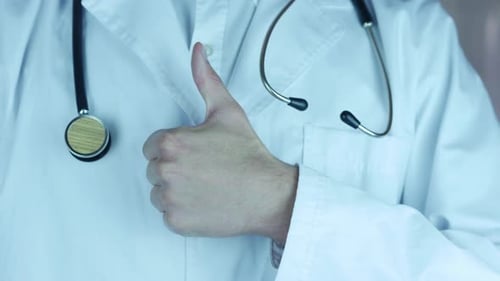 Medical Professional Giving Thumbs Up Close Up