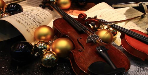 Violins with Ornaments and Sheet Music Close Up