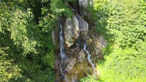 Aerial View of Waterfall in Lush Green Forest