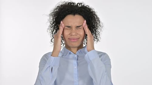 Young Woman Massaging Temples with a Headache