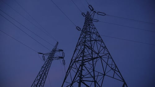 Electric Pylons and Powerlines at Night