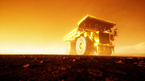 Giant Mining Dump Truck on Dusty Ground at Sunset