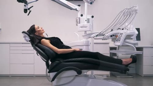 Girl Lying in a Chair in the Dental Clinic