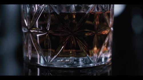 Crystal Glass of Amber Liquor Close Up