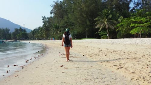 Sexy happy ladies travelling enjoying life on the beach on summer white sand and blue background 4K