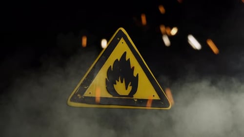 Flammable Materials Sign Over a Smoky Background