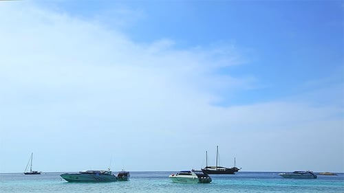 Boats and Yachts Anchored in Turquoise Tropical Sea