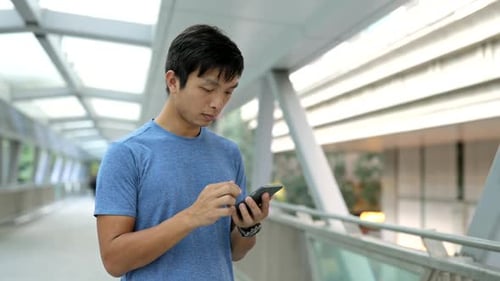 Man using cellphone in city