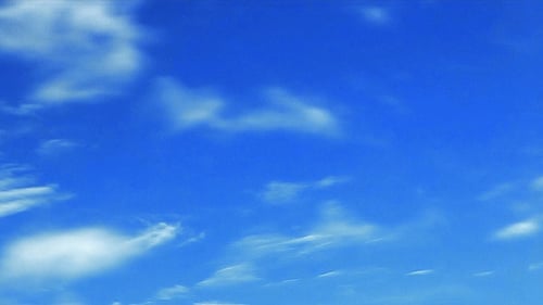 Clouds Moving Across Blue Sky During the Day