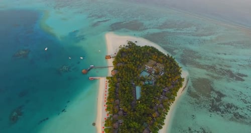 Aerial drone view of a scenic tropical island in the Maldives.