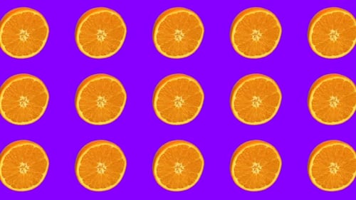 Vibrant Orange Slices Rotating on Purple Background