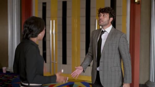 Argument Between Man and Woman in Theater Lobby