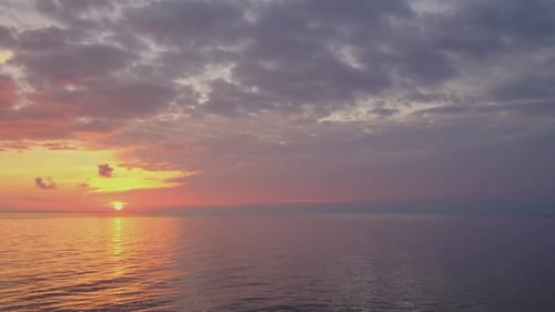 Golden Ocean Sunset with Colorful Clouds