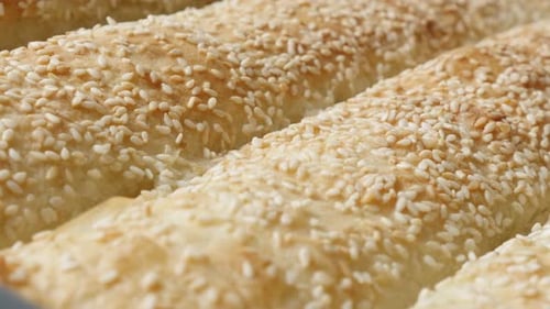 Golden Brown Rolls with Sesame Seeds Close Up