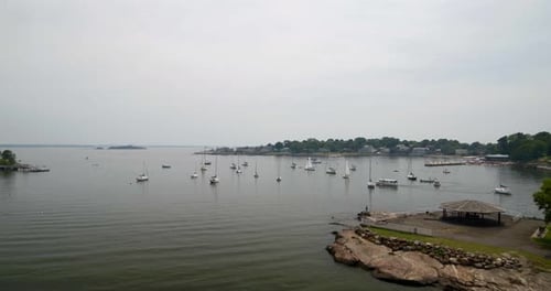 Flying Over Echo Bay and Towards Docked Boats on a Cloudy Day