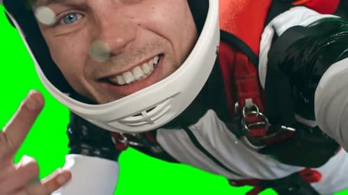 Smiling Man Wearing Helmet Against Green Screen