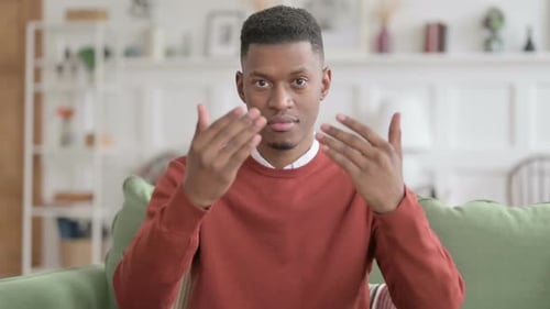 Young Adult Invites Viewer to Come Closer