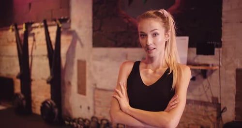 Attractive Female Athlete In Sportswear At Gym