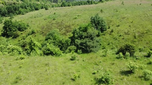 Aerial drone view of a flying over the rural agricultural landscape.