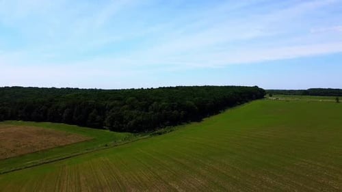 Aerial drone view of a flying over the rural agricultural landscape.