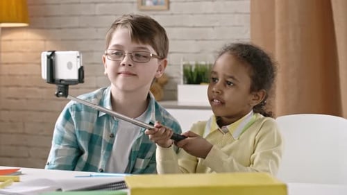 Children Taking Selfie with Phone Indoors