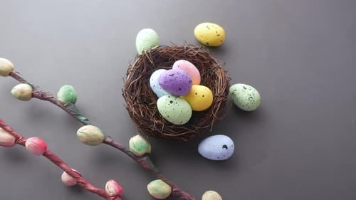 Decorative Bird Nest with Colorful Easter Eggs on Gray