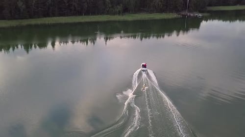 Water Skier Towed by Boat on a Lake