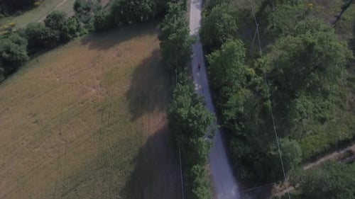 Man cycling with mountain bike on countryside road