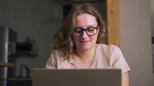 Woman Works on Laptop at Home, Close Up