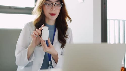 Woman Doctor Explaining Medicine on Video Call